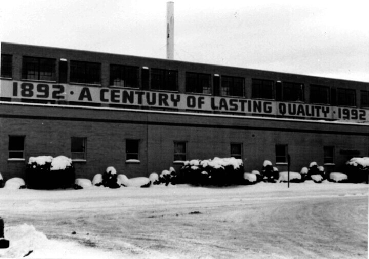 Image of the Merrill location original building with the 100 year banner on the front