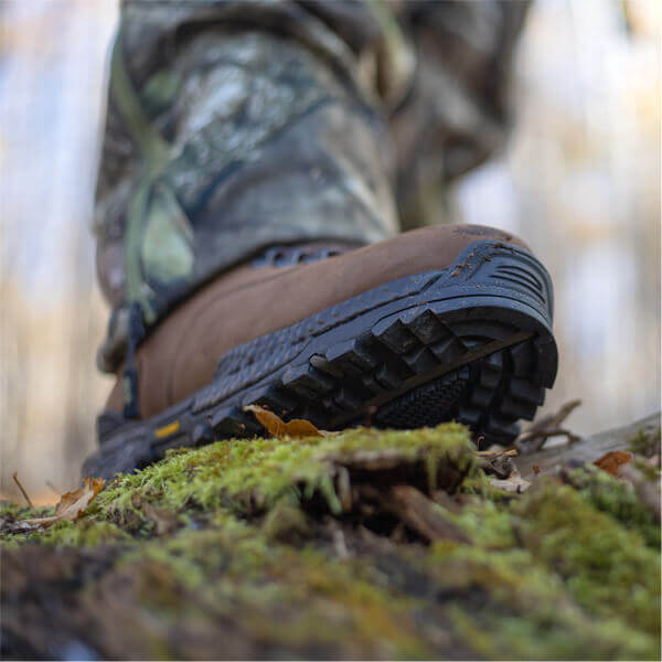 Image of Infinity FD series 7" Studhorse insulated waterproof outdoor boot on a person stepping on a log