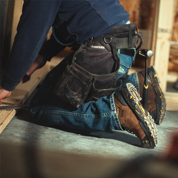 Image of infinity FD series 8" studhorse waterproof safety toe boot on a person kneeling on concrete