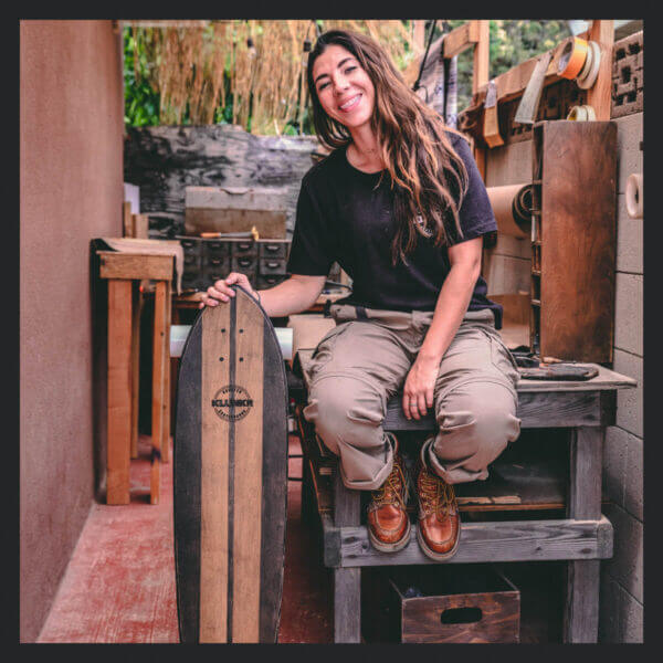 Image of a girl sitting on a work bench wearing the 814-4200 boots