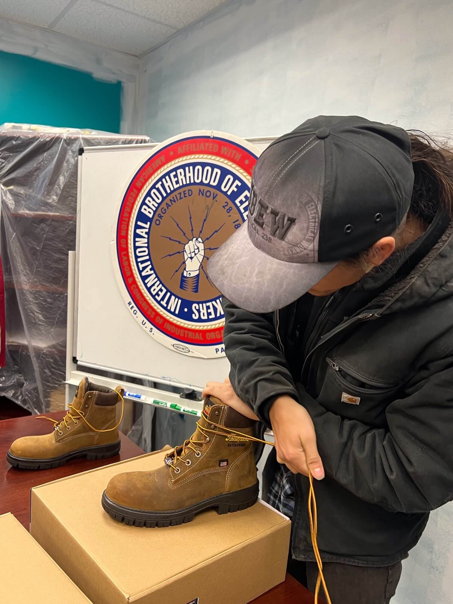 IBEW 238 electrician laces up new Thorogood boots.