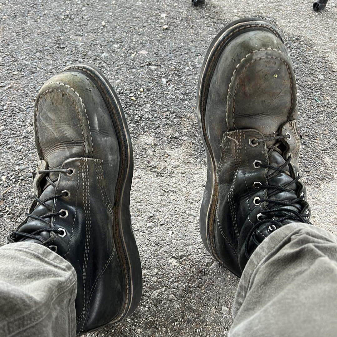 Image of a pair of midnight series boot on a person