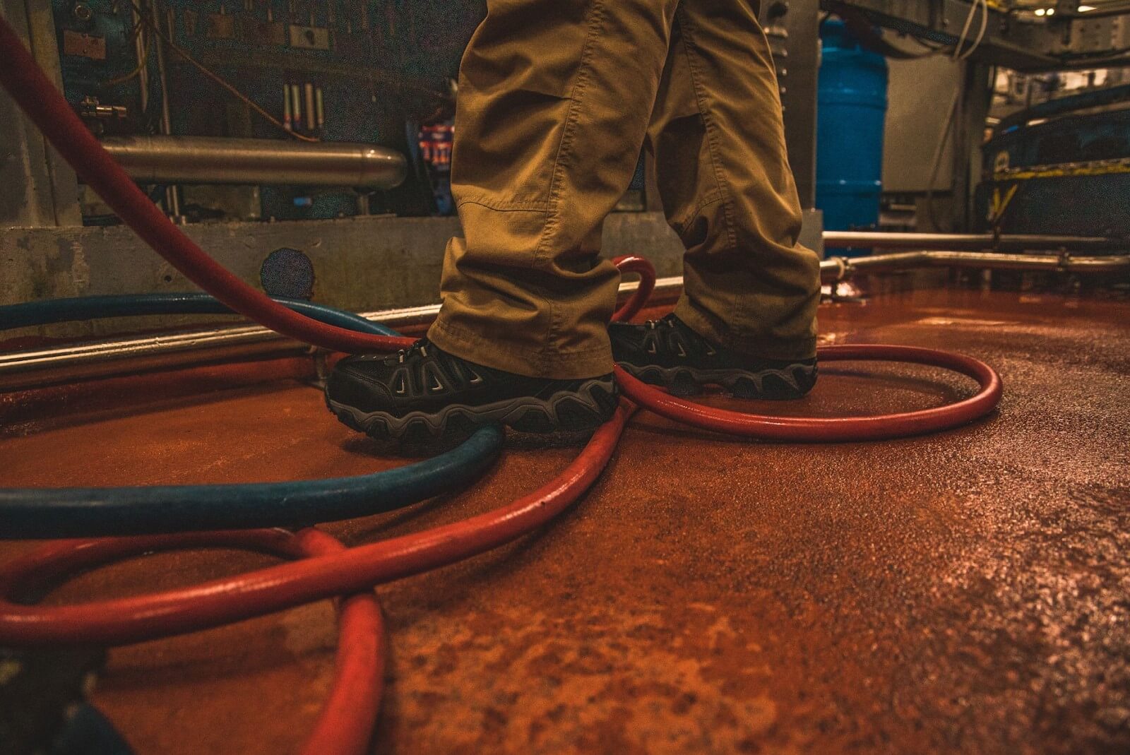 Man wears Crosstrex series waterproof work boots to stay dry and comfortable on damp floor.