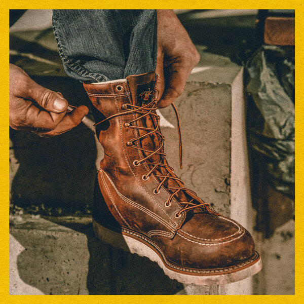 Image of a person lacing up their American Heritage 8" crazyhorse moc toe wedge boots