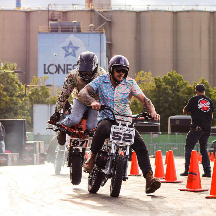 Image of a guy rinding a sport bike in a race