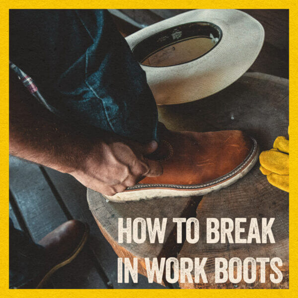Person putting jeans over top of Wellingtons for How to break in work boots blog post