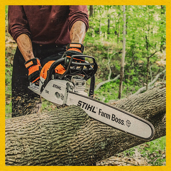 Image of a person cutting a log using a Stihl chainsaw